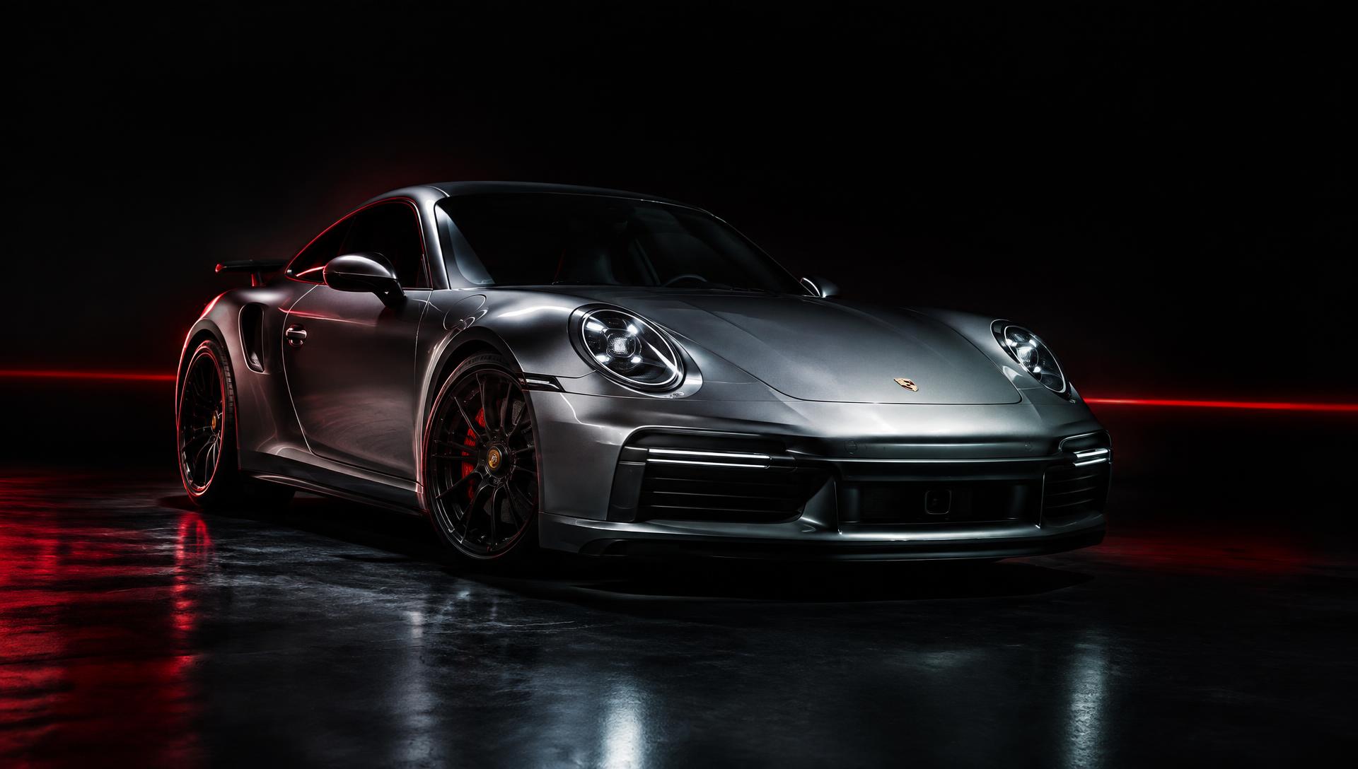 Silver sports car in a dark studio